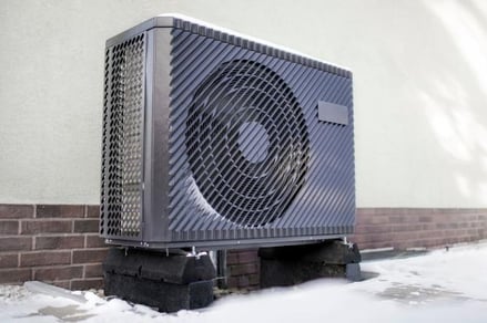 Black Heat Pump in Snow